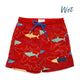 Red swim shorts with shark pattern on a white background