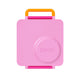 Pink snack container with orange handle on a white background