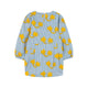 Children's dress with yellow star pattern on a light blue background