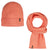 Coral beanie and scarf set on a white background